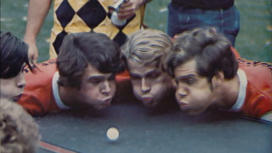 RG_Blow pong 1.jpg colorized photo of students blowing on a ping pong ball from the 1975 Bric-a-Brac