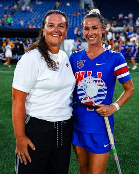 RachaelDeCecco_WLL.png Rachael (Becker) DeCecco ’03, left, with WLL All-Star Game MVP Marie McCool.