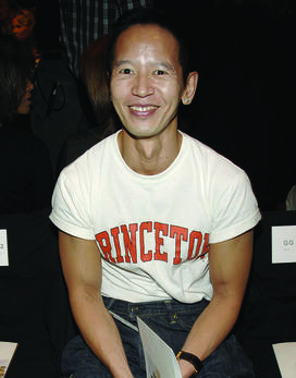 Long Nguyen ’84 wearing a white T-shirt that says PRINCETON in orange letters.