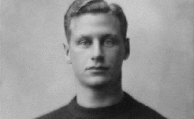 Black and white photo of Hobey Baker in his Princeton sweater. 