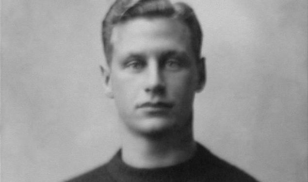 Black and white photo of Hobey Baker in his Princeton sweater. 