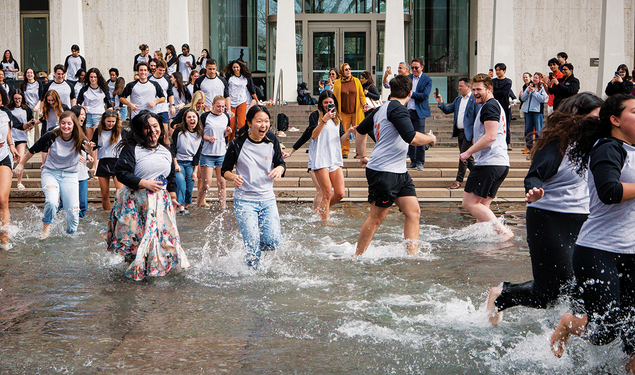 SPIA students celebrate in the Fountain of Freedom