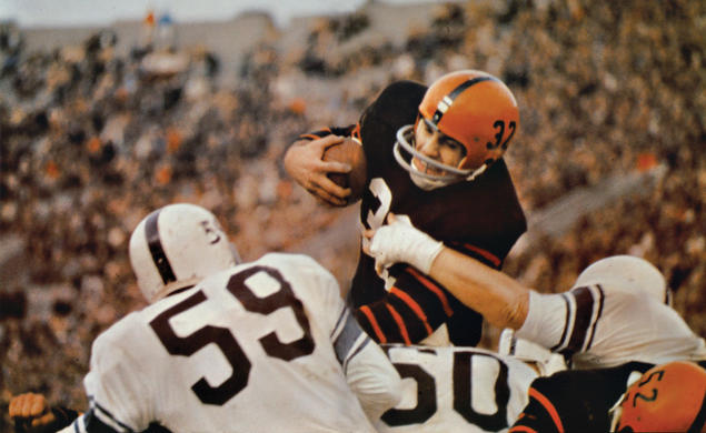 Fullback Cosmo Iacavazzi ’65 *68 carrying the ball 