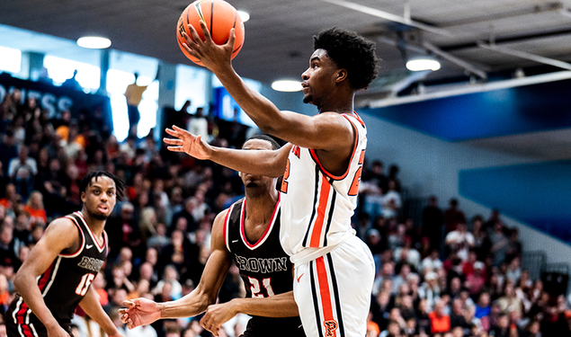 Dalen Davis scoops for a layup with his left hand