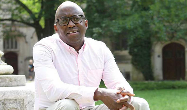 Jacob Dlamini sitting on steps on Princeton's campus.