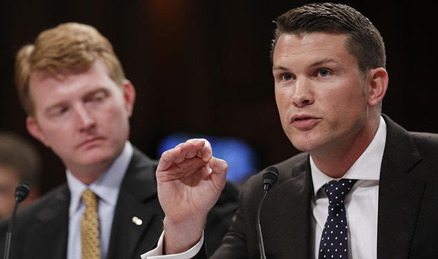 Pete Hegseth ’03, left, and another Army captain speak at a Senate Judiciary Committee hearing.