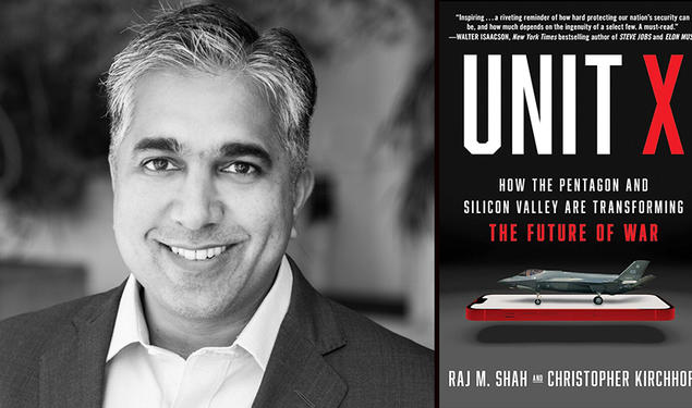 Raj Shah with the cover of his book, "Unit X," featuring an image of a fighter jet on top of a cell phone.