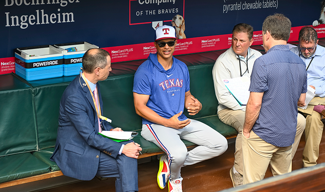 Will Venable sits in baseball dugout and speaks with reporters