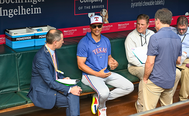 Will Venable sits in baseball dugout and speaks with reporters