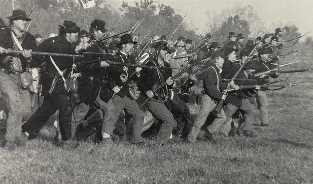 An estimated 40,000 Americans take part in reenactments of Civil War battles, like this one last October at Spring Hill, Tennessee. 