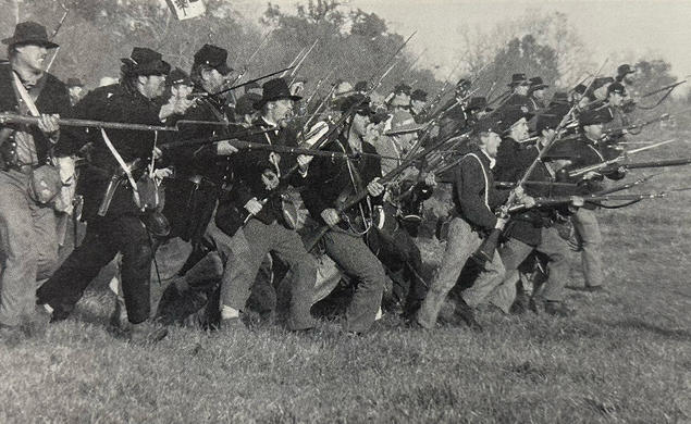 An estimated 40,000 Americans take part in reenactments of Civil War battles, like this one last October at Spring Hill, Tennessee. 