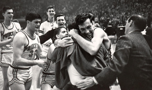 Bill Bradley ’65 embraces coach Butch van Breda Kolff ’45 after Princeton beat Providence to advance to the 1965 Final Four, the program’s only appearance in the men’s basketball national semifinals.