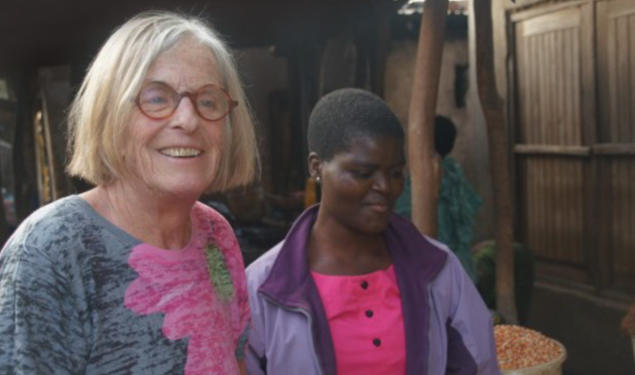 Susan Cotts Watkins *80, left, in Malawi with young Malawian girl.