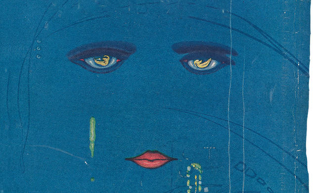The cover of "The Great Gatsby," with an illustration of a woman's face over a city at night.