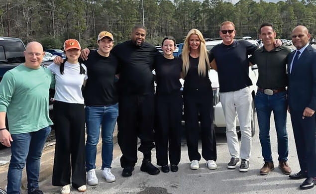 IVERY DORSEY, FOURTH FROM LEFT, GREETS THE TEAM THAT WORKED FOR HIS RELEASE