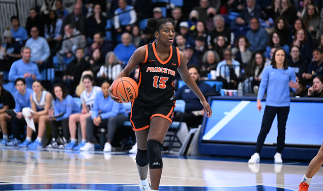 Fadima Tall dribbles near the center of the court against Columbia