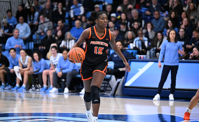 Fadima Tall dribbles near the center of the court against Columbia