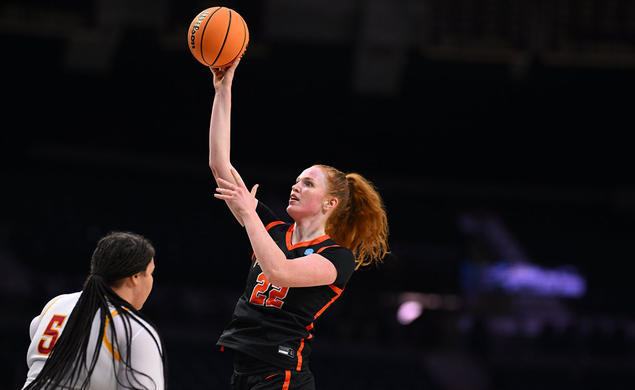 Parker Hill shoots with her right hand over defender Audi Crooks