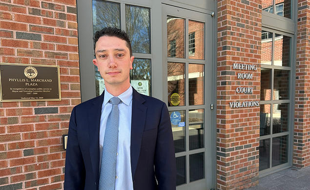 David Piegaro ’25 stands in front of Municipal Court.
