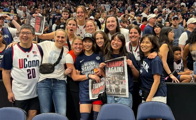 Kaitlyn Chen ’24, center, celebrates Connecticut’s national championship with family and friends, including Princeton head coach Carla Berube.