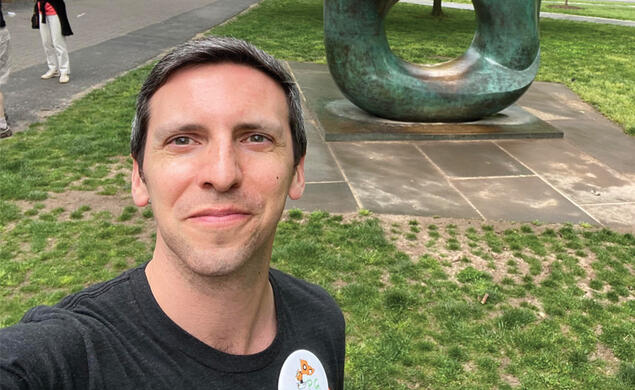 P.G. Sittenfeld ’07 takes a selfie in front of the Oval with Points sculpture at Reunions in 2022.