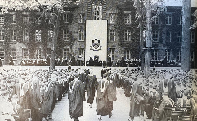 A black-and-white photo of commencement in front of Nassau Hall.