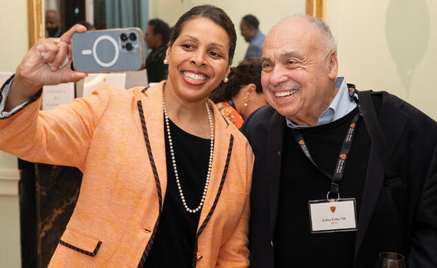 Karen Jackson-Weaver ’94 takes a selfie with Julius Coles *66 during a reception at Prospect House. 