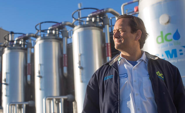 George Hawkins ’83 founded Moonshot Missions is pictured here in front of a thermal hydrolysis reactor and flash tank which converts wastewater biosolids into usable energy
