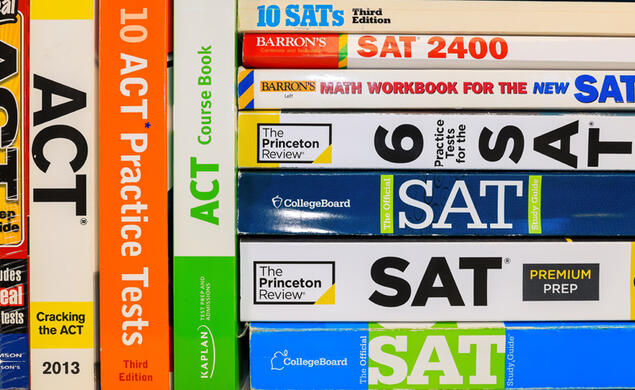 Stack of colorful SAT and ACT test prep books