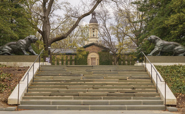 OTC_Hazing.jpg Two Tiger statues sit at the top of staircase on campus with Nassau Hall in the background