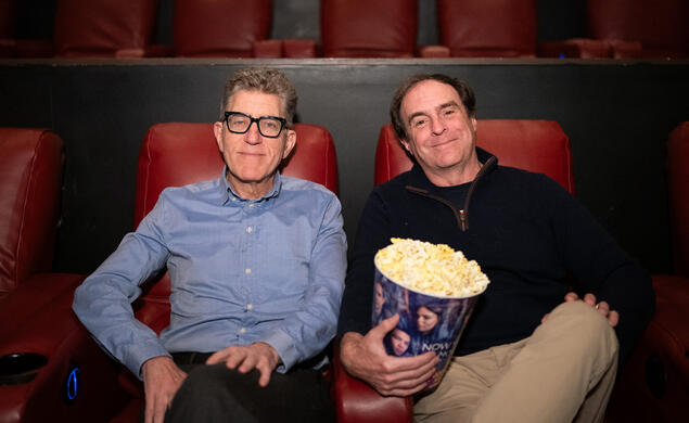 Mitchell Duneier and Mark Bernstein at the AMC Marketfair 10 movie theater sitting in their seats with popcorn waiting to watch the new Springsteen movie
