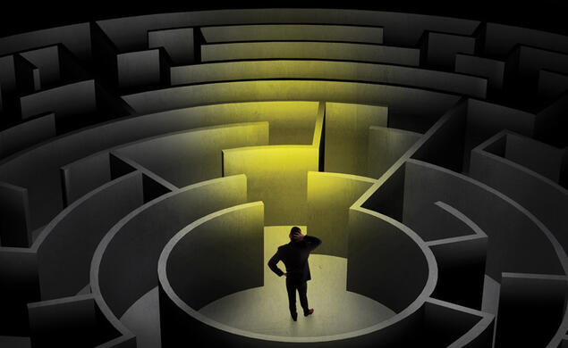 illustration of a person in a dark maze trying to decide which way to go