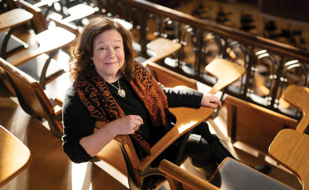 Cressey Belden ’91 sits at a desk in McCosh 50.