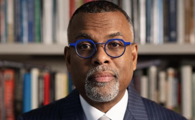 Eddie Glaude Jr. *97 photographed in front of a bookshelf 