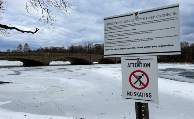 Signage warns that skating is banned on a frozen Lake Carnegie 