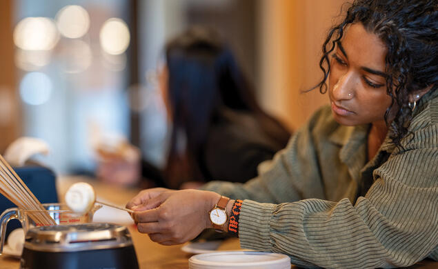 OTC_Science of Roasting 1.jpg Sanjana Venkatesh ’26 roasts a marshmallow at the Science of Roasting event.