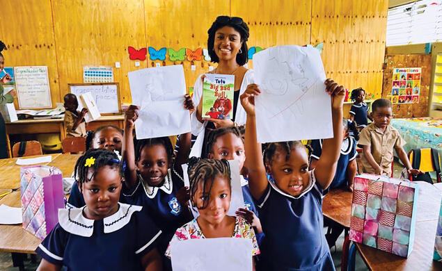Sophia Steele ’23 visits students at the Chester Castle Primary School in Hanover, a school supported by the residency.
