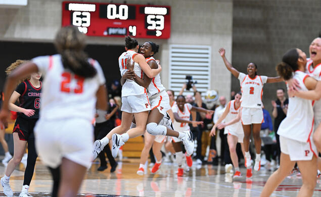 The women’s basketball team celebrates after beating Harvard to win Ivy Madness and advance to the NCAA Tournament.