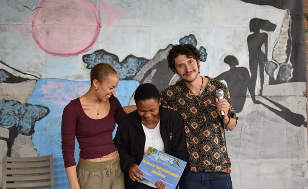 From left, Tanaka Dunbar Ngwara ’24, student Queen Sibanda, and Dominic Dominquez ’25 celebrate Sibanda's award.