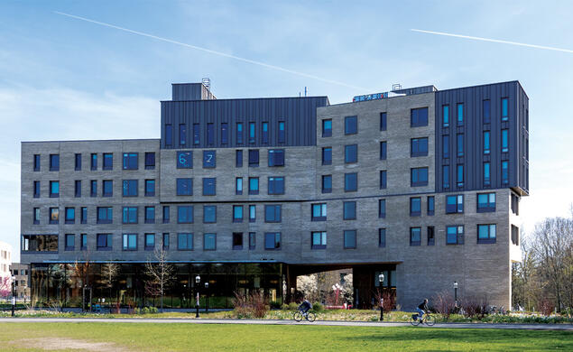 The large, gray exterior of Huo College.
