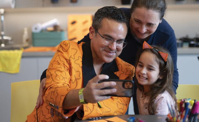 At left, Mario Moya &rsquo;01, his wife, Rebecca Hoberg, and their daughter, Anastasia, pause for a selfie before getting back to making art at the museum during Reunions.