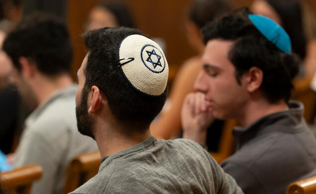 studetns attend a vigil on the fiorst anniversary of the Oct. 7 attacks