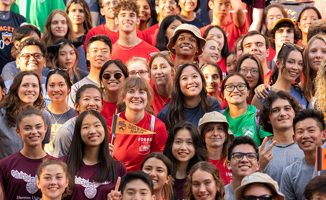Group of students in colorful residential college t-shirts