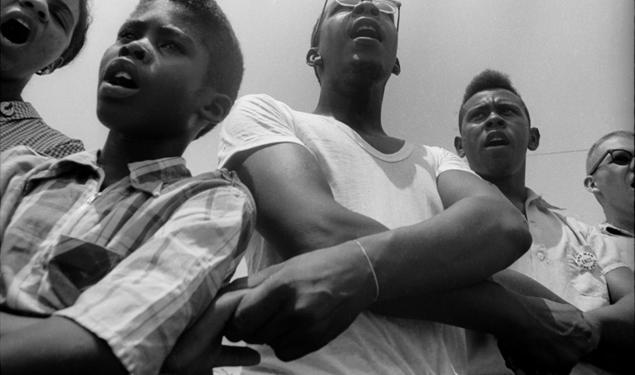 Freedom School, Mileston. Mississippi Summer Project, 1964:  Summer volunteers, SNCC workers and local students singing freedom songs at Mileston, a community of independent black farmers in the Mississippi Delta near Lexington.