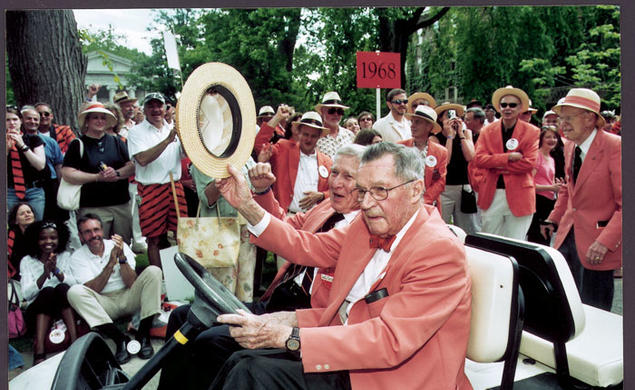 Robert F. Goheen ’40 *48, with Wallace Irwin ’40 *48, acknowledges the cheers of alumni during the 2005 P-rade.