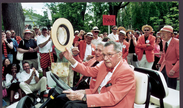 Robert F. Goheen ’40 *48, with Wallace Irwin ’40 *48, acknowledges the cheers of alumni during the 2005 P-rade.