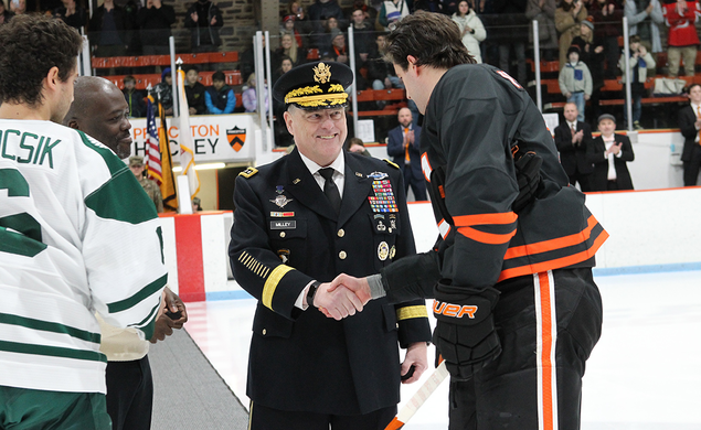 On the ice, Gen. Mark Milley ’80, chair of the Joint Chiefs of Staff, shakes hands with Princeton captain Pito Walton ’23 after the ceremonial puck drop.