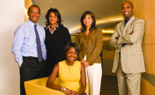 Together for Chicago — and for the presidential campaign of Michelle Obama ’85’s husband — are, from left, John Rogers ’80, Sharon Fairley ’82, Mellody Hobson ’91 (sitting), Kevann Cooke ’82, and Dwight McBride ’90, at the offices of Ari