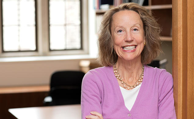 Anne Case, photographed in front of an empty office.