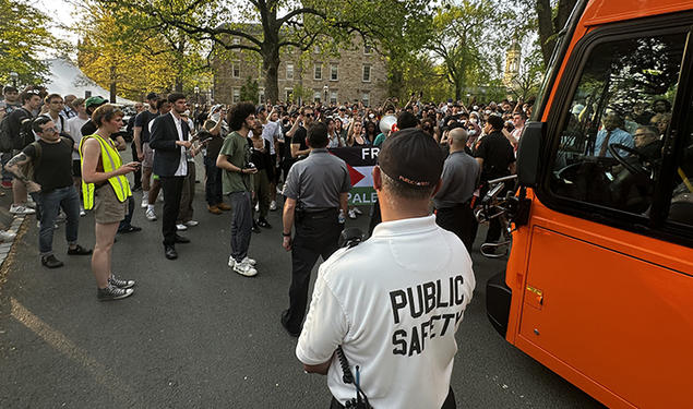 Protesters around the bus in front of Clio Hall.